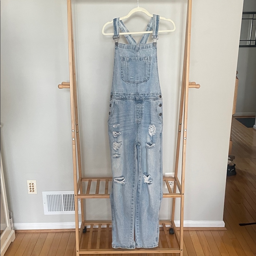 Distressed denim overalls